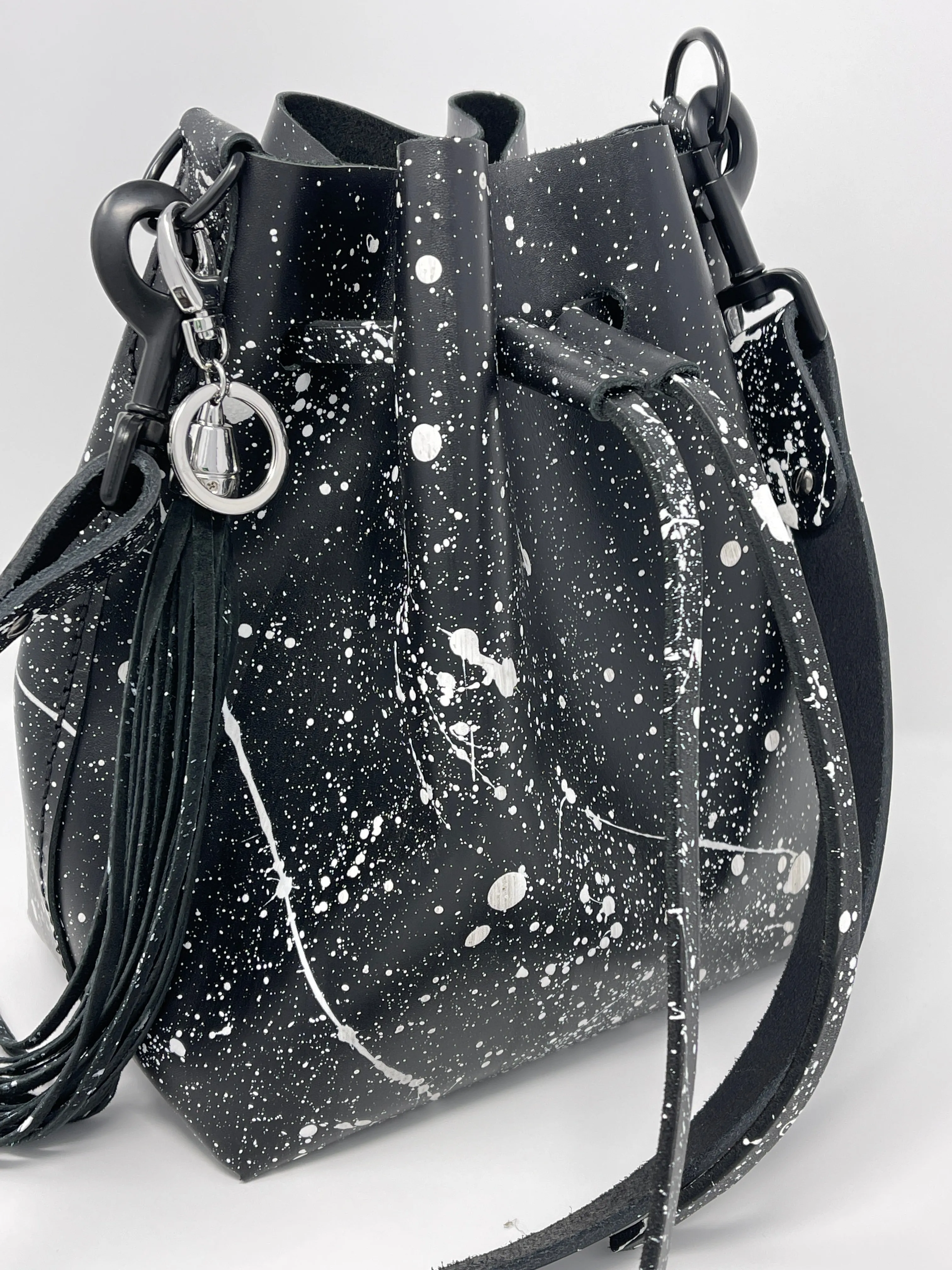 Black Leather Drawstring Bucket Shoulder Bag With Matte White Splatter